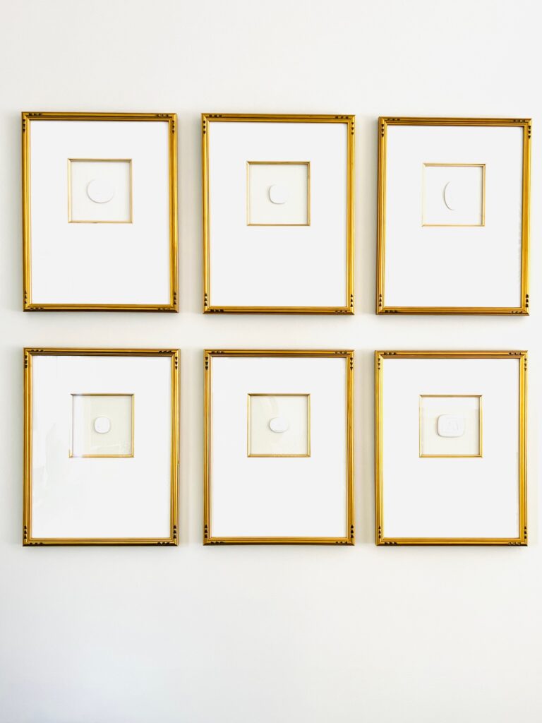 Karyn Heard art wall shades of white living room